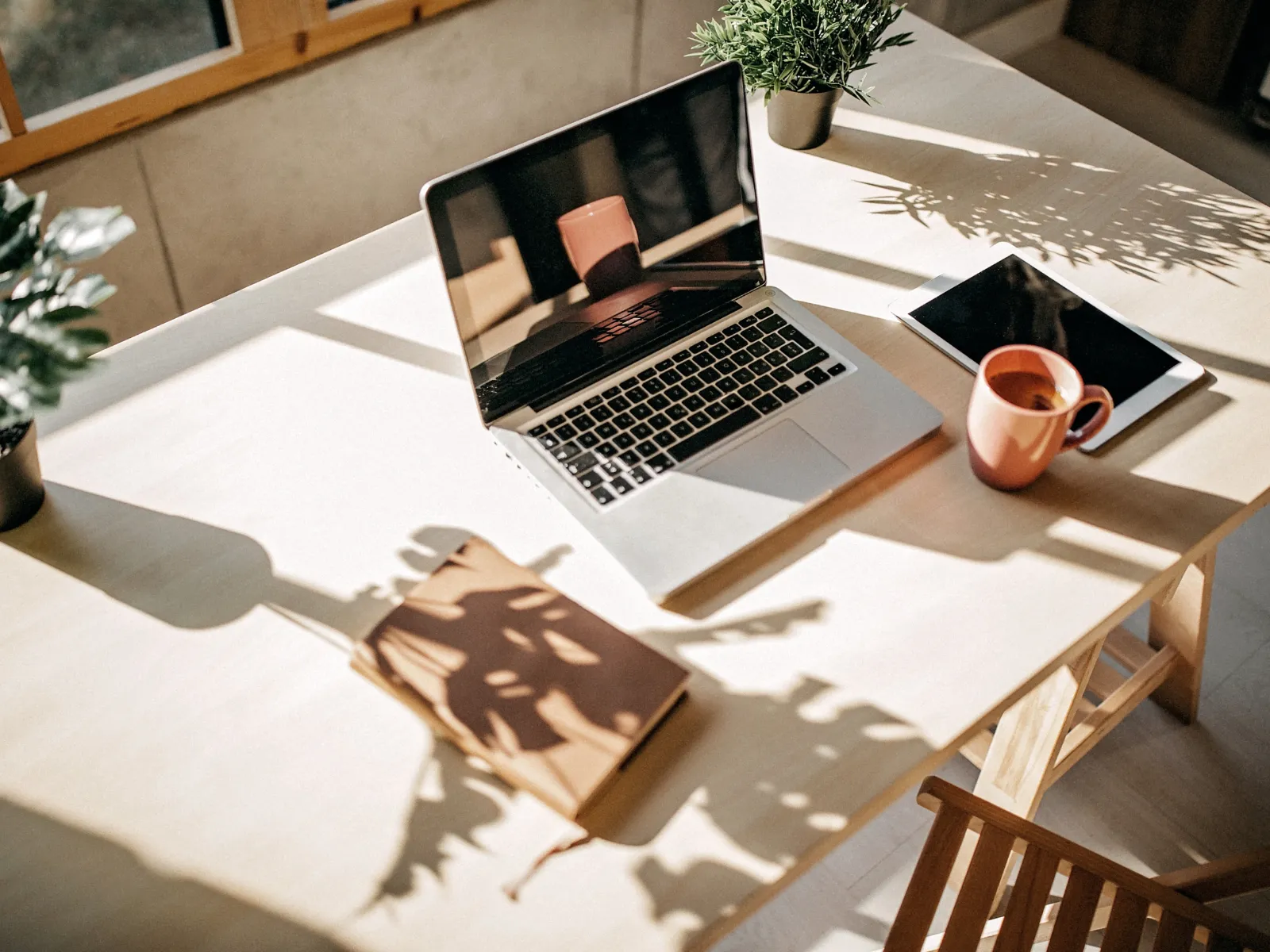 Warm office desk with a laptop prepared for a business consultation